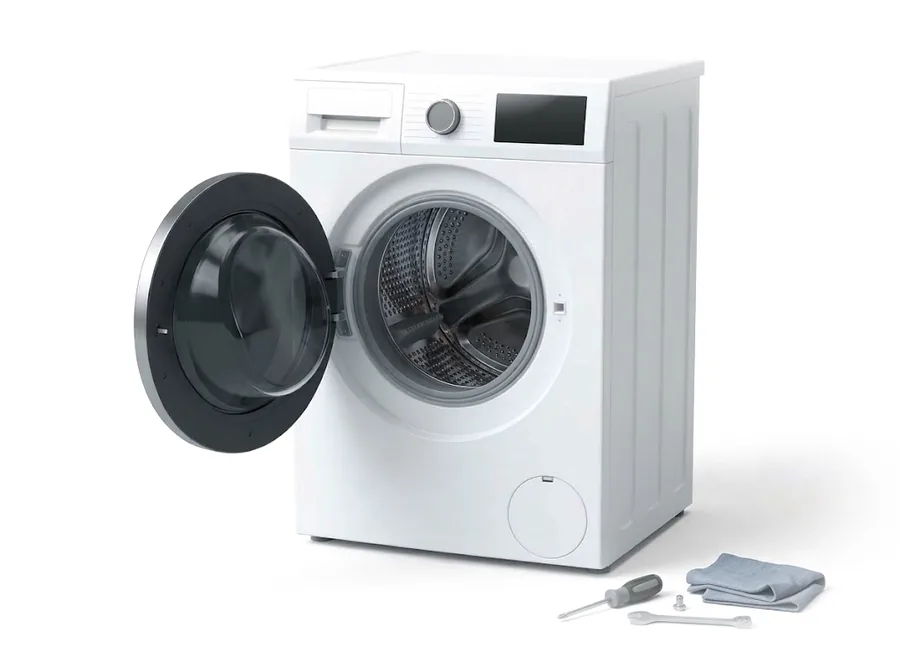 A white washing machine with its door open, with a screwdriver, spanner and cloth on the floor beside it